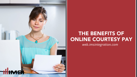 Woman staring at statement and computer